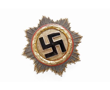 ORDER OF THE GERMAN CROSS MEDALcompleted in five parts with four rivets, the eight pointed silvered star with slightly smalle