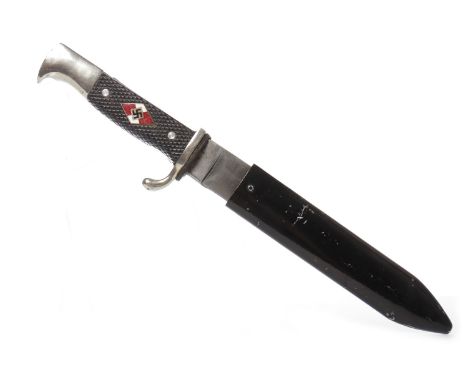 GERMAN HITLER YOUTH STYLE KNIFEenamelled swastika on two-piece checkered black plastic grip, in steel scabbard, the blade wit