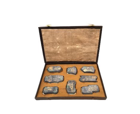 A Chinese calligraphy stone ink block set circa 1900, intricately carved in relief and hand painted with gilt embellishments,