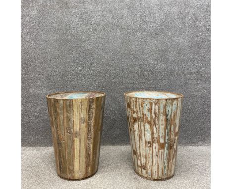 A pair of mid to late 20th century lamp or side tables of cylindrical barrel form constructed using distressed and painted pl