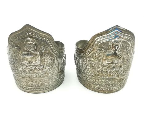 A pair of early 20th century repousse Chinese silver cuffs decorated with buddha and lotus motifs and Chinese figures. Stampe