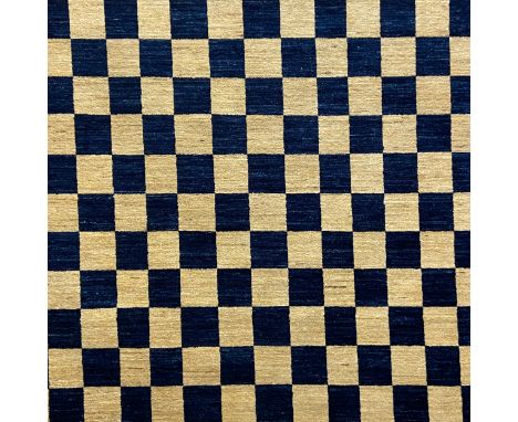 A contemporary woollen Afghan Choobi carpet having an all-over chequered pattern in midnight blue over a beige field. L.196 W