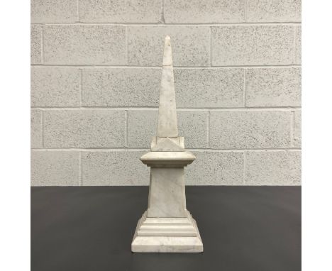 A late 19th century white marble obelisk (with repair to the spire as seen). H.48cm