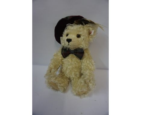 Modern Steiff Teddy Bear, Having button and label to left ear, wearing a tartan bonnet and bow tie, 26cm high