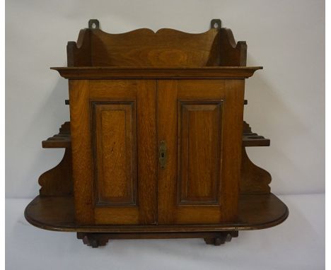 Mahogany Wall Hanging Smokers Cabinet, Having two doors enclosing fitted drawers, flanked by open shelving and pipe compartme