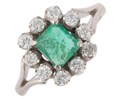 An 18ct white gold emerald and diamond cluster ring, set with octagonal step-cut emerald and modern round brilliant-cut diamo