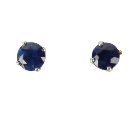 A pair of 9ct white gold sapphire stud earrings, claw set with round-cut sapphires, 4.4mm, 0.8g . Condition Report:No damage 