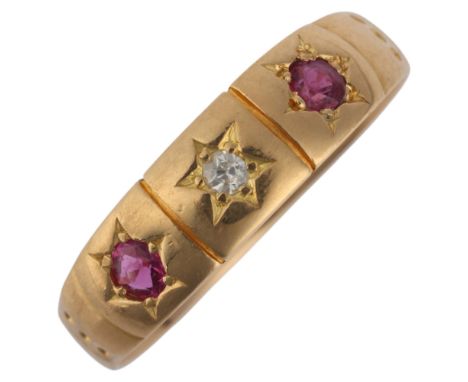 An Antique 18ct gold three stone garnet and diamond ring, unmarked mount tests as 18ct, setting height 5.5mm, size R, 3.7g . 