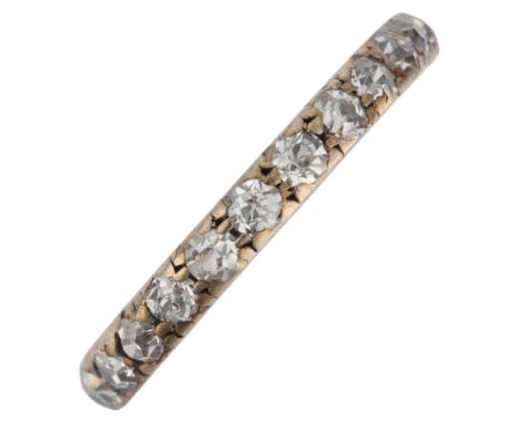 An Antique silver-topped gold diamond full eternity ring, set with old-cut diamonds, band width 2.5mm, size K, 1.4g . Conditi
