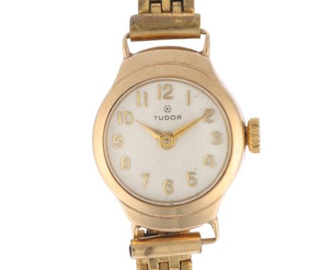 TUDOR - a lady's Vintage 9ct gold mechanical bracelet watch, circa 1950s, silvered dial with gilt Arabic numerals, lance hand