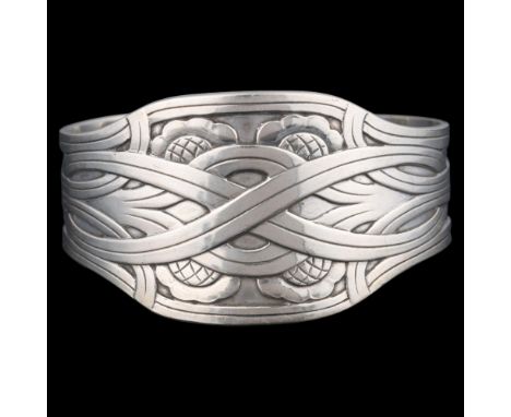 GEORG JENSEN - a Danish sterling silver 'Celtic' cuff bangle, designed by Harald Nielsen, model no. 55, with Celtic knot deco
