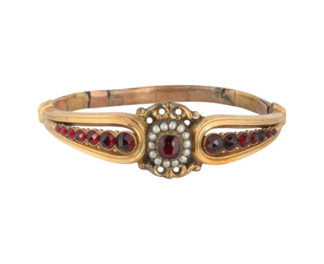 An Antique Victorian garnet and split pearl hinged bangle, unmarked mount tests as 9ct and 14ct gold, setting height 18.2mm, 