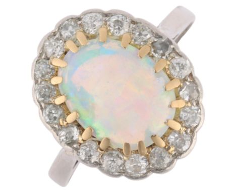 An Antique platinum opal and diamond cluster ring, re-hallmarked for London 2016, claw set with 0.65ct oval cabochon opal sur
