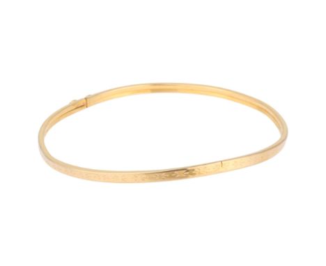 A 9ct gold bangle, band width 2.8mm, internal circumference 17cm, 3.3g . Condition Report:Bangle is quite dented and bent out