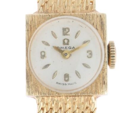 OMEGA - a lady's Vintage 14ct gold mechanical bracelet watch, circa 1966, silvered dial with gilt quarterly Arabic numerals, 