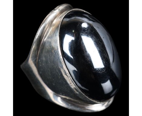 BENT KNUDSEN - a large heavy Danish modernist sterling silver hematite ring, rub-over set with oval cabochon hematite, model 