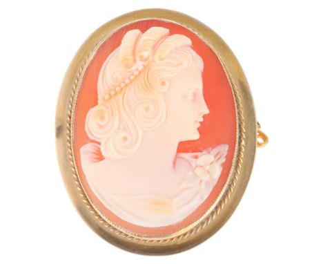 A Vintage 9ct gold shell cameo brooch, relief carved depicting female profile, 35.1mm, 7.6g . Condition Report:No damage or r