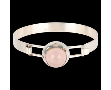 P H KJAER-HANSEN - a Danish modernist silver rose quartz torque bangle, set with round high cabochon rose quartz, setting hei