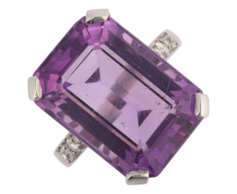 A 9ct white gold and silver amethyst and diamond ring, claw set with octagonal step-cut amethyst and modern round brilliant-c