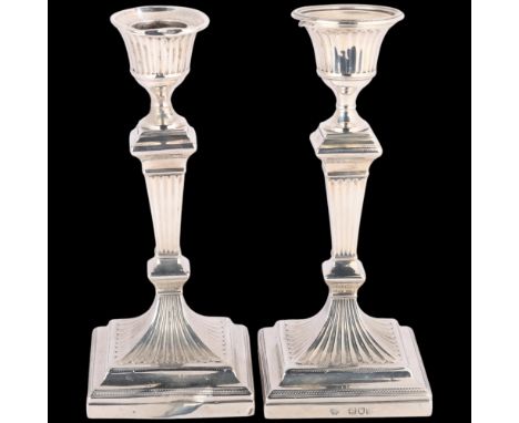 A pair of late Victorian Neo-Classical Revival silver table candlesticks, William Hutton & Sons Ltd, London 1896, 17cm, 24.7o
