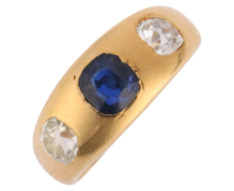 An Antique 18ct gold three stone sapphire and diamond gypsy ring, maker JB, indistinct date, rub-over set with 0.65ct cushion