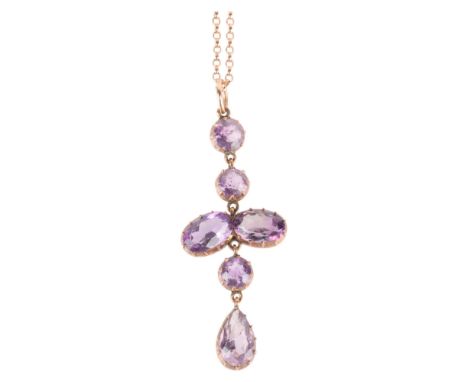 An Edwardian 9ct rose gold amethyst drop pendant necklace, cut-down collet set with oval and round-cut amethysts, on later 9c