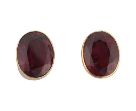 A pair of 9ct gold single stone garnet stud earrings, rub-over set with oval mixed-cut garnets, 10.2mm, 2.6g . Condition Repo