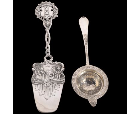 A 19th century Dutch silver serving slice, 22.5cm, and a Continental silver? tea strainer, 3.9oz total (2) . Condition Report