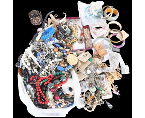 A large quantity of costume jewellery, including pearl necklaces, silver bracelet, etc . Condition Report:Lot sold as seen un
