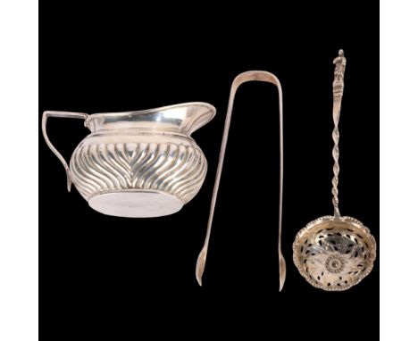Various silver, including fluted cream jug, George III sugar tongs, etc, 3.9oz total (3) . Condition Report:Lot sold as seen 