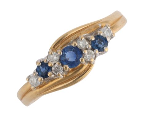 A 14ct gold sapphire and diamond crossover ring, maker G & TJ, setting height 7.1mm, size R, 3.4g . Condition Report:No damag