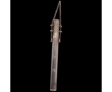 A George V silver pen holder, maker MT & B, Birmingham 1912, cylindrical form, with allover engine turned decoration and inte