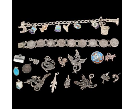 Various silver jewellery, including enamel charm bracelet, dragon pendants, animal charms, etc . Condition Report:Lot sold as