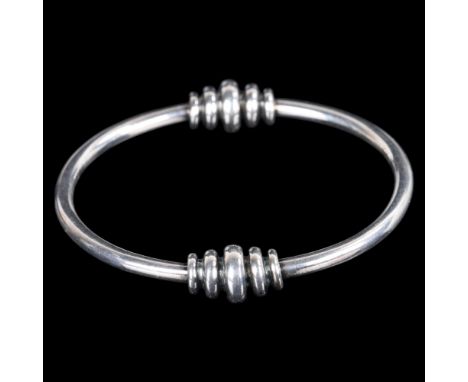 HORSENS SOLVVAREFABRIK - a Danish modernist sterling silver slave bangle, with graduated hoop mounts, setting height 11.6mm, 
