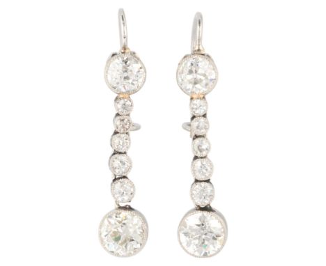 A pair of Edwardian platinum diamond drop earrings, millegrain set with graduated old European-cut diamonds, with kidney fitt