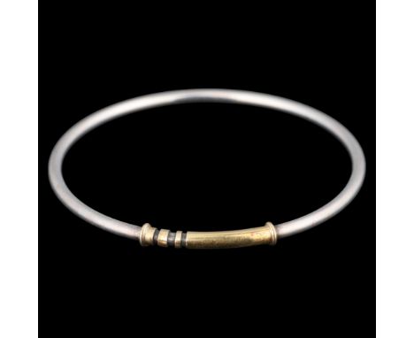 GEORG JENSEN - a Danish modernist sterling silver and silver-gilt slave bangle, designed by Hans Hansen, band width 3mm, inte