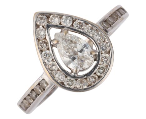 An 18ct white gold diamond pear halo cluster ring, set with 0.4ct pear-cut diamond surrounded by channel set modern round bri