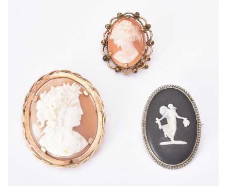 
	
		A shell cameo brooch, the oval panel carved with the profile of floral, within a gold coloured setting, stamped 9ct, 4.7