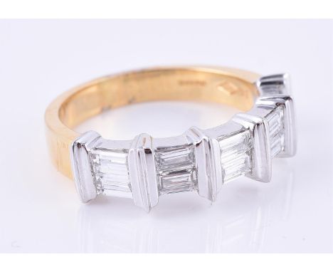 
	
		An 18 carat gold diamond ring, set with ten baguette cut diamonds, approximately 1.00 carat total, on a yellow gold shan