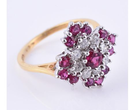 
	
		A diamond and synthetic ruby cluster ring, the quatrefoil panel with circular cut rubies and brilliant cut diamonds, 18 