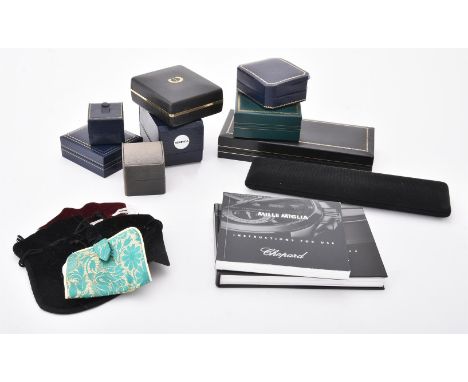 
	
		A collection of watch boxes, instruction booklets and papers, to include: a Patek Philippe case; Sekonda watch box; Chop