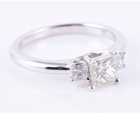 
	
		A diamond three stone ring, the graduated princess cut diamonds in four claw settings, approximately 0.60 carats total, 