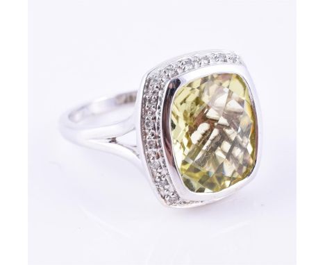 
	
		A diamond and lemon quartz cluster ring, the fancy cut lemon quartz within a surround of brilliant cut diamonds, stamped