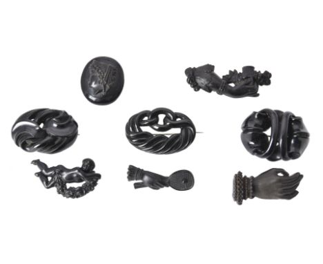 
	
		Y&nbsp;A collection of Victorian jet and black pressed brooches, circa 1860, comprising three jet brooches of polished c