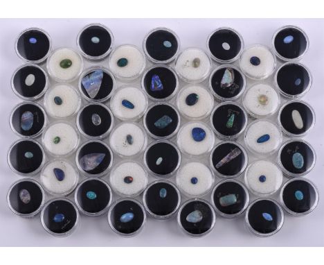 
	
		†&nbsp;A collection unmounted opal cabochons, matrix and doublets, and a cabochon jade; approximately forty four total
	