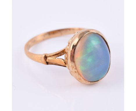 
	
		A 9 carat gold opal dress ring, the oval cabochon opal within a collet setting, finger size M 1/2, 3.8g gross
		
		Condi