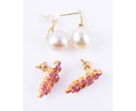 
	
		A pair of ruby earrings, set with marquise and oval cut rubies, stamped 916, 1.9cm long, 5.3g gross; and a pair of fresh