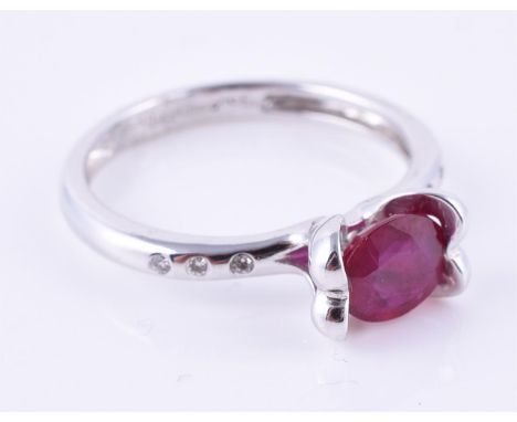 
	
		A synthetic ruby single stone ring, the oval mixed cut synthetic ruby claw set above diamond three stone shoulders, moun