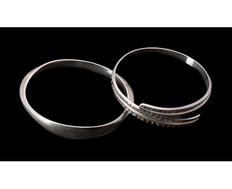 
	
		A silver coloured bangle by David Andersen, the shaped bangle signed David-Andersen Norway Sterling 925S INV.B.S.Ø.  A, 