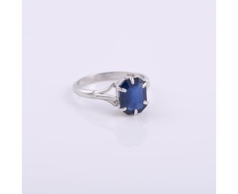 
	
		A synthetic sapphire single stone ring, the step cut sapphire in a six claw mount, stamped 9ct, finger size L, 2.4g gros